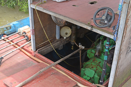 The boat is moored to a pier in the Chao Phraya River.の写真素材