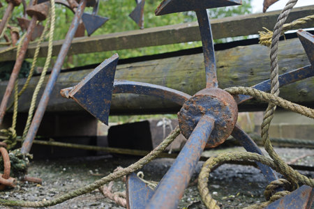 Anchor on an old wooden pier, closeup of photoの写真素材