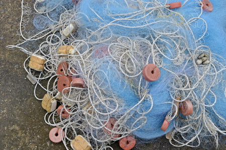 Fishing nets and floats on the ground, closeup of photoの写真素材