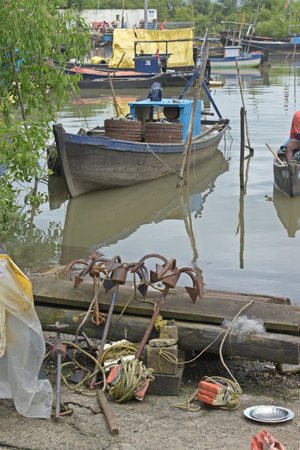 fishing boats on the bank of the river in the netherlandsの写真素材