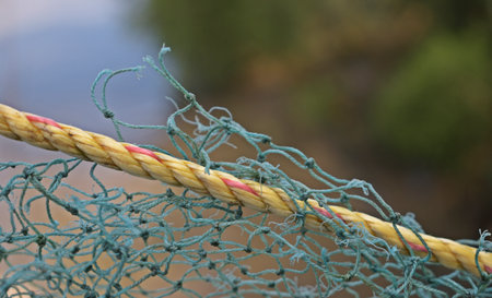 Fishing net on the beach. Selective focus with shallow depth of field.の写真素材