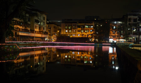 Reflection of buildings in the water at night