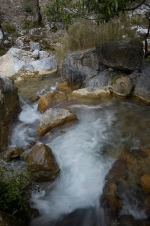 Mountain stream in the forest, close-up of a waterfallの写真素材