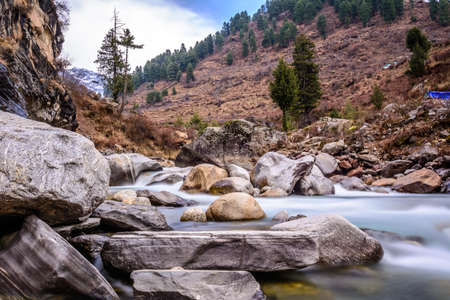 Landscape of glacial river and Himalayan mountains in winterの写真素材