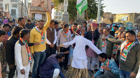 Beawar, Rajasthan, India, Jan. 29, 2021: Congress workers raise slogans and burnt effigy of Indian Prime Minister Narendra Modi during a protest against Modi's central government's anti-farmers measures and riots, in Beawar. Farmers have been protesting aのeditorial素材