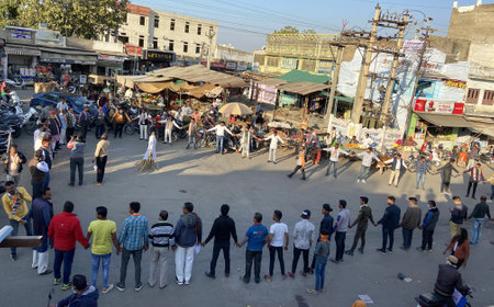 Beawar, Rajasthan, India, Jan. 29, 2021: Congress workers hold hands while forming a human chain during a protest against Indian PM Narendra Modi's central government's anti-farmers measures and riots, in Beawar. Farmers have been protesting at Delhi bordのeditorial素材