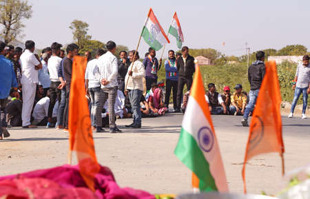 Beawar, Rajasthan, India, Feb. 6, 2021: Farmers and Congress workers blocked national highway 14 during nationwide chakka jam (roadblock-protest) to support ongoing agitation against government's farm reform laws, in Beawar. Protesters chanting slogans agのeditorial素材