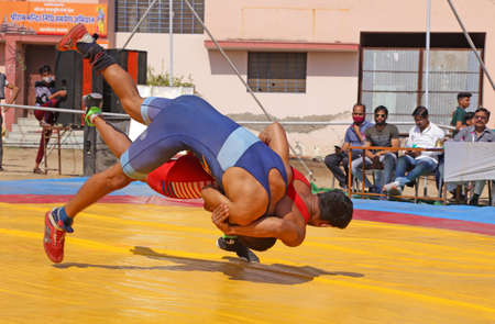 Beawar, Rajasthan, India, February 14, 2021: Wrestlers in their match during state level Greco-Roman wrestling championship in Beawar. Photo: Sumit Saraswatのeditorial素材