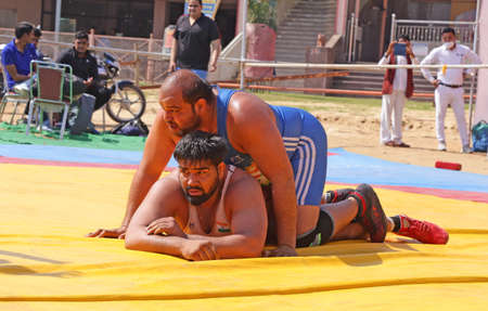 Beawar, Rajasthan, India, February 14, 2021: Wrestlers in their match during state level Greco-Roman wrestling championship in Beawar. Photo: Sumit Saraswatのeditorial素材