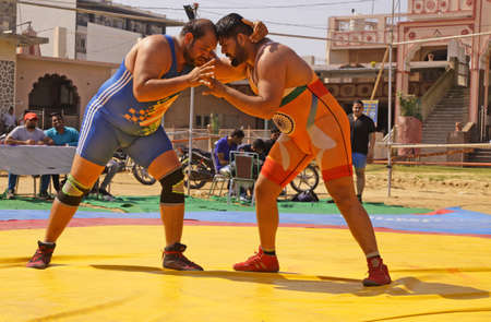 Beawar, Rajasthan, India, February 14, 2021: Wrestlers in their match during state level Greco-Roman wrestling championship in Beawar. Photo: Sumit Saraswatのeditorial素材