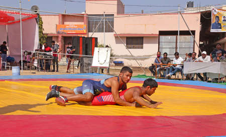 Beawar, Rajasthan, India, February 14, 2021: Wrestlers in their match during state level Greco-Roman wrestling championship in Beawar. Photo: Sumit Saraswatのeditorial素材