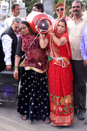 Beawar, Rajasthan, India, Feb. 15, 2021: Congress party activists demonstrate with gas cylinder during protest against Modi government after hike in fuel & LPG prices, in Beawar. Photo: Sumit Saraswatのeditorial素材