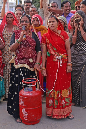 Beawar, Rajasthan, India, Feb. 15, 2021: Congress party activists demonstrate with gas cylinder...