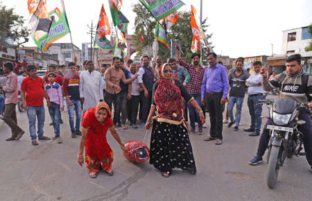 Beawar, Rajasthan, India, Feb. 15, 2021: Congress party activists demonstrate with gas cylinder during protest against Modi government after hike in fuel & LPG prices, in Beawar. Photo: Sumit Saraswatのeditorial素材