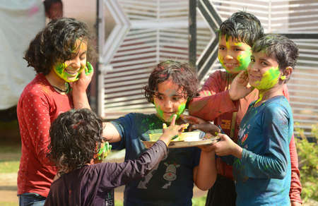 Beawar, Rajasthan, India, March 2, 2018: Children play with colors as they celebrate Holi, the spring festival of colours, in Beawar. Photo: Sumit Saraswatのeditorial素材