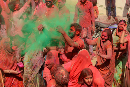 Beawar, Rajasthan, India, March 2, 2018: Indian people apply colored powder 'gulal' on each other to celebrate Holi, the spring festival of colours, in Beawar. Photo: Sumit Saraswatのeditorial素材