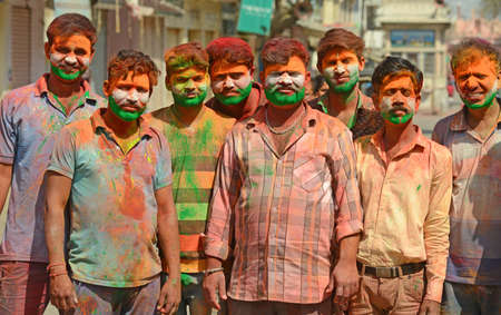 Beawar, Rajasthan, India, March 2, 2018: Youngsters paint tricolor of Indian flag on their face as they celebrate Holi, the spring festival of colours, in Beawar. Photo: Sumit Saraswatのeditorial素材