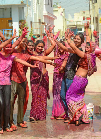 Beawar, Rajasthan, India, March 2, 2018: Indian women dance as they celebrate Holi, the spring festival of colours, in Beawar. Photo: Sumit Saraswatのeditorial素材