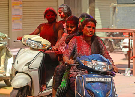 Beawar, Rajasthan, India, March 2, 2018: Indian girls celebrate Holi, the spring festival of colours, in Beawar. Photo: Sumit Saraswatのeditorial素材
