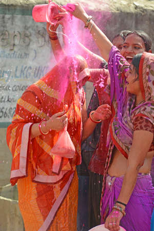 Beawar, Rajasthan, India, March 2, 2018: Indian women play with colors and water as they celebrate Holi, the spring festival of colours, in Beawar. Photo: Sumit Saraswatのeditorial素材