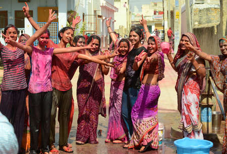 Beawar, Rajasthan, India, March 2, 2018: Indian women dance as they celebrate Holi, the spring festival of colours, in Beawar. Photo: Sumit Saraswatのeditorial素材