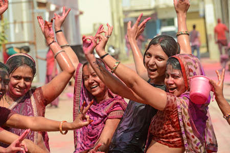 Beawar, Rajasthan, India, March 2, 2018: Indian women dance as they celebrate Holi, the spring festival of colours, in Beawar. Photo: Sumit Saraswatのeditorial素材