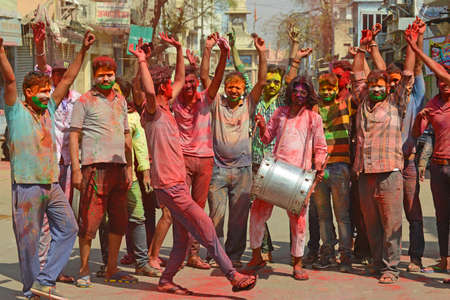 Beawar, Rajasthan, India, March 2, 2018: Revellers dance on dhol beats as they celebrate Holi, the spring festival of colours, in Beawar. Photo: Sumit Saraswatのeditorial素材