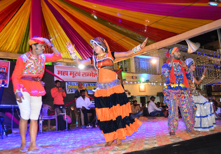 Beawar, Rajasthan, India, March 1, 2018: Rajasthani artist perform during Maha Murkh Sammelan (Grand Foolish Conference) on the night of Holi festival in Beawar. Photo: Sumit Saraswatのeditorial素材