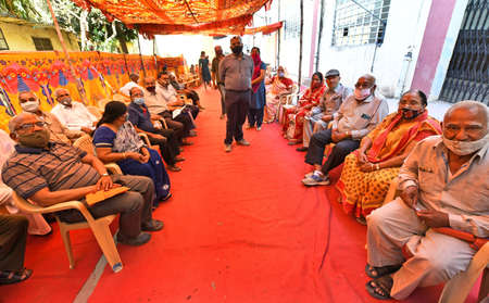Beawar, Rajasthan, India, March 2, 2021: Senior citizens wait for their turn to receive a dose of COVID-19 vaccine, during countrywide inoculation drive, at a hospital in Beawar. Photo: Sumit Saraswatのeditorial素材