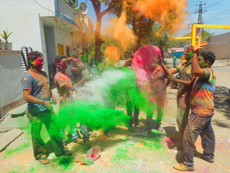 Beawar, Rajasthan, India, March 24, 2016: Youngsters celebrate Holi, the Hindu spring festival of colors, in Beawar. Photo: Sumit Saraswatのeditorial素材