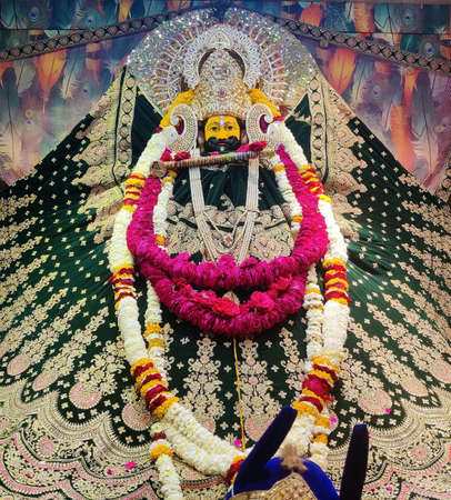 Beawar, Rajasthan, India, March 24, 2021: Idol of Hindu God Khatu Shyam Baba, form of Lord Krishna at a temple during spring Fagun Fair ahead of Holi color festival in Beawar. Photo: Sumit Saraswatのeditorial素材