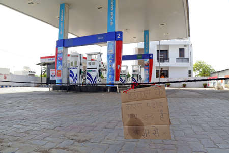 Beawar, India, April 10, 2021: A fuel pump looks deserted due to one-day strike called by Rajasthan Petroleum Dealers Association with demand of rollback in VAT on fuel. Photo: Sumit Saraswatのeditorial素材