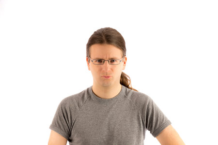 Blonde man is looking with frustrated eyes