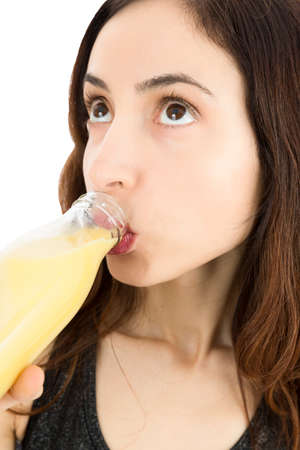 Close up of woman drinking banana smoothieの写真素材