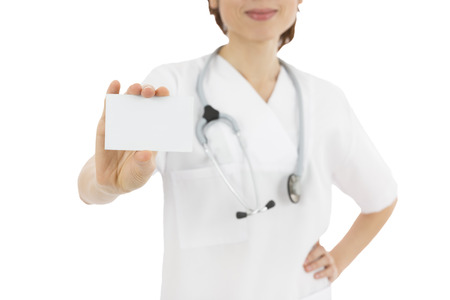 Female medical doctor showing sign cardの写真素材