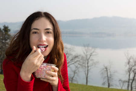 Woman eating breakfastの写真素材