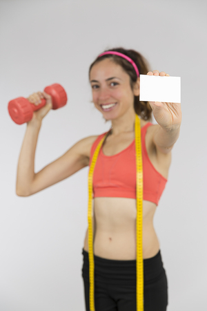 Weight loss woman showing sign cardの写真素材