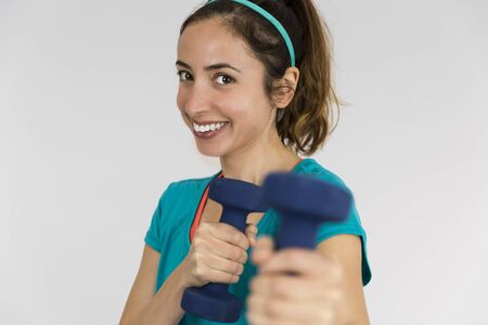 Fitness woman with dumbbellsの写真素材