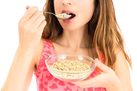 Woman eating oatmealの写真素材