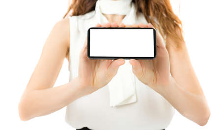 Woman showing smart phone with copy spaceの写真素材