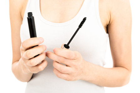 Make up mascara and brush in woman handsの写真素材