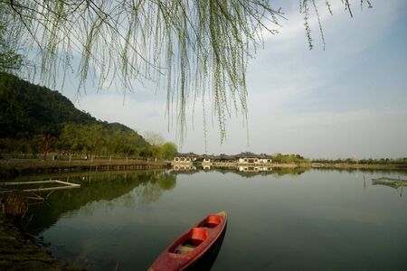 A boat lying peaceful on the lakeの写真素材