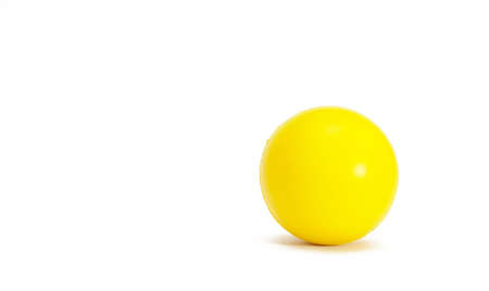yellow ball on the tableの写真素材