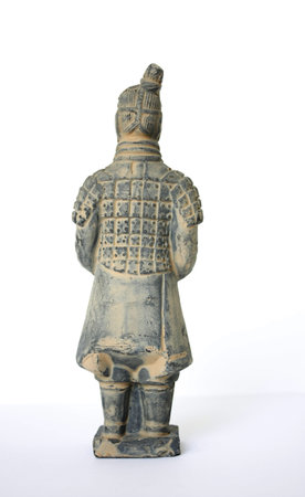 Back view of a standing terracotta worrier foot solider against a white background の写真素材
