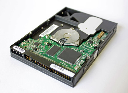 Perspective view of 3.5 hard disk exposing the curcuit board and microchips