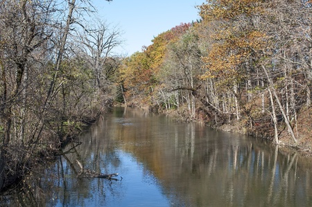 The swollen Normans Kill Creek presents a colorful scene off Route 20 in Guilderland, New York の写真素材