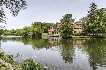 Geese make their may across the Washington Park Lake in Albany, New York  In the background if the well know bathhouse の写真素材