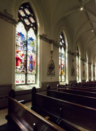 Stained glass windows grace the interior of the Cathedral of St  John the Baptist Roman Catholic Church in Charleston, South Carolina のeditorial素材