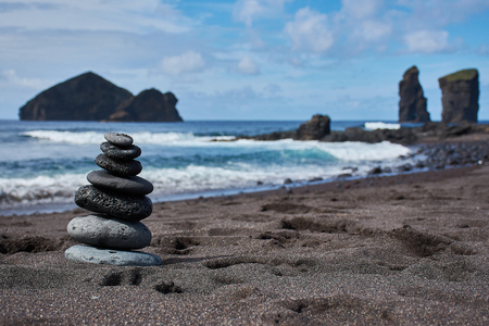Zen tower on the beach of Mosteirosの写真素材