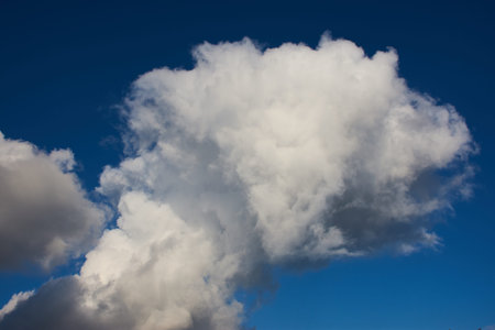 Cotton wool clouds in the blue autumn sky